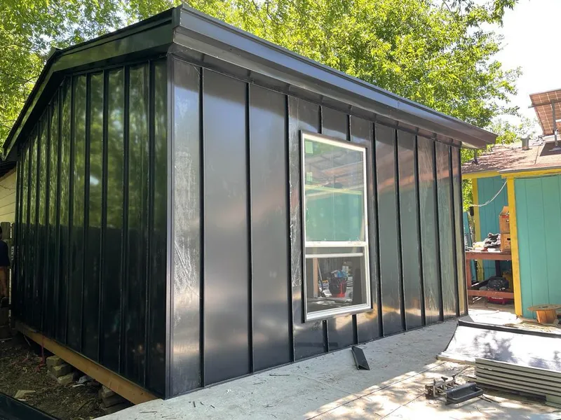 Black standing seam metal wall panels for Roof Inspection in Little River